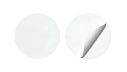 Two blank white circular stickers, one peeling. Black background. Light and shadow details