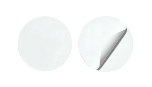 Two blank white circular stickers, one peeling. Black background. Light and shadow details