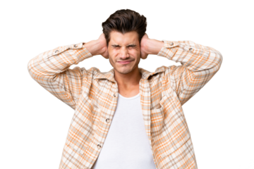 Young handsome caucasian man over isolated background frustrated and covering ears