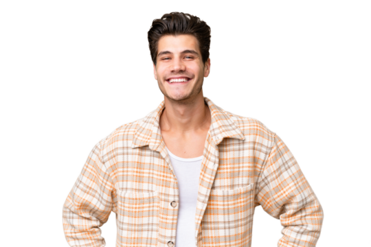 Young handsome caucasian man over isolated background posing with arms at hip and smiling