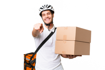 Delivery man wearing a helmet bike over isolated background pointing front with happy expression