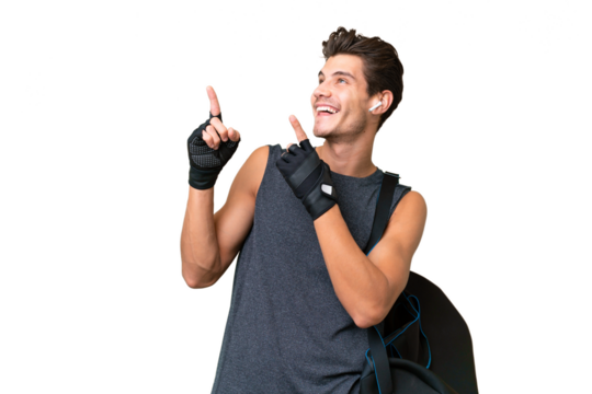 Young sport caucasian man with sport bag over over isolated background pointing with the index finger a great idea