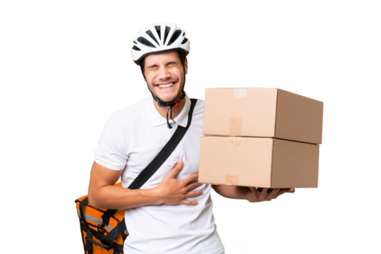 Delivery man wearing a helmet bike over isolated background smiling a lot - Powered by Adobe