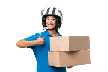 Young Argentinian  delivery woman over isolated background with thumbs up because something good has happened