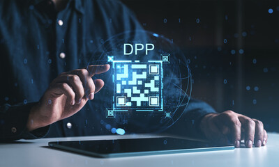 Man interacting with digital product passport QR code hologram on tablet interface concept at night with futuristic data streams in background.