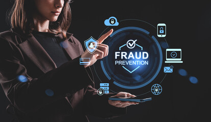Businesswoman interacting with holographic fraud prevention interface concept on digital screen in...