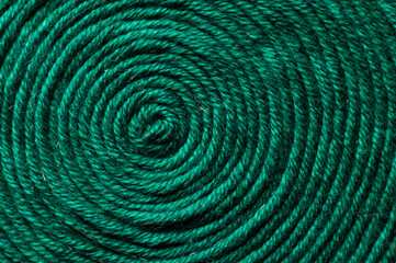 A solid background of colorful threads for cross stitch and needlework. Textured background for needlework and design. Rainbow of threads. Rows of colorful embroidery threads.