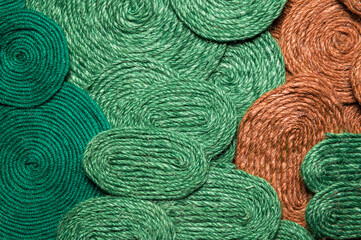 A solid background of colorful threads for cross stitch and needlework. Textured background for needlework and design. Rainbow of threads. Rows of colorful embroidery threads.