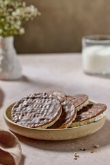 plate of rice galettes cakes cookies covered with milk chocolate