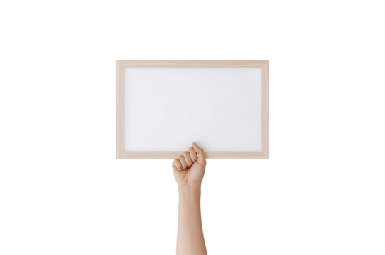 Hand holding wooden frame with blank canvas