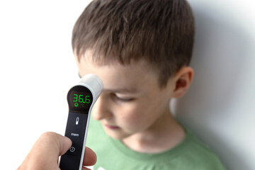 Infrared Thermometer Measuring Childs Temperature Medical Check Concept