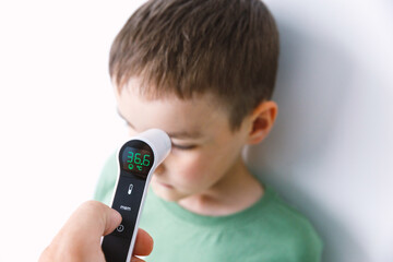 Infrared Thermometer Measuring Childs Temperature Medical Check Concept
