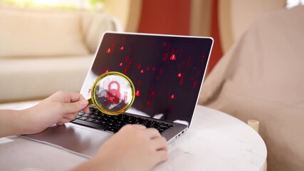 Cybersecurity expert using a magnifying glass to inspect a security threat, symbolized by a red padlock icon on a laptop screen with binary code. - Powered by Adobe