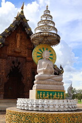 An intricate temple complex with traditional architectural elements. At the center is a statue of a...