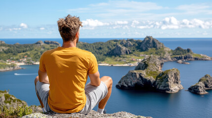 Man sits peacefully cliff edge, overlooking stunning island bay with clear blue waters and rocky