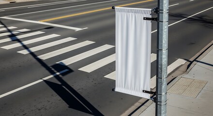 Blank White Banner on Street Pole at Crosswalk, Sunny Day
