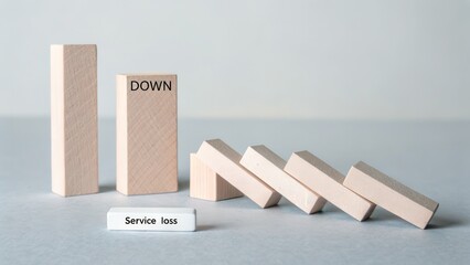 Wooden blocks domino effect showing service loss and decline