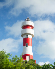 Red and white lighthouse in El Cuyo, a fishing village in Yucatan, Mexico.