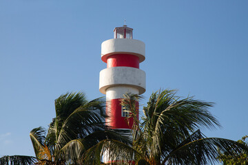 Red and white lighthouse in El Cuyo, a fishing village in Yucatan, Mexico.