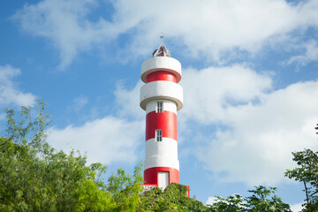 Red and white lighthouse in El Cuyo, a fishing village in Yucatan, Mexico.