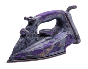 A weathered, aged iron, mottled with purple and gold, sits angled.  Its handle displays similar discoloration, and small mechanical details are visible