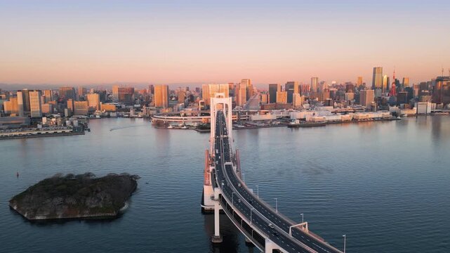 tokyo city skyline aerial view drone of city bay waterfront,flying over rainbow bridge landmark with modern high-rise building in the background