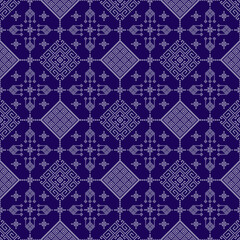 A traditional geometric textile pattern in navy blue and white, featuring intricate diamond, floral, and line motifs arranged in symmetrical horizontal bands. Geometric pixel art pattern