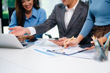 Business people meeting at office writing notes about sticky notes Laptop,tablet Planning and Brainstorming Strategies of Colleagues in office.
