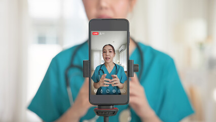Young adult woman Gen Z asia people anti aging expert modern nurse live talk viral video selfie camera on mobile phone app mental health care. Online sharing digital virtual asian vlogger filming.