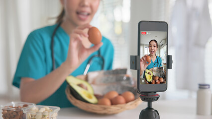 Asia woman people anti aging expert modern health care vlogger live advice talk selfie video mobile phone camera. Online diet food weight loss HDL meal plan recipe digital virtual asian coach filming.