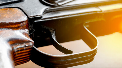 Kalashnikov assault rifle on a wooden background