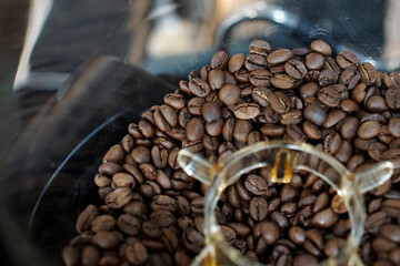 Top view of coffee bean in grinder hopper.      