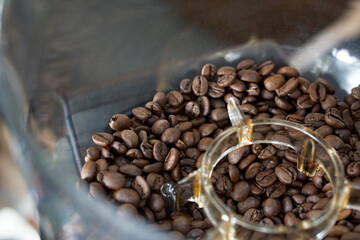 Top view of coffee bean in grinder hopper.      