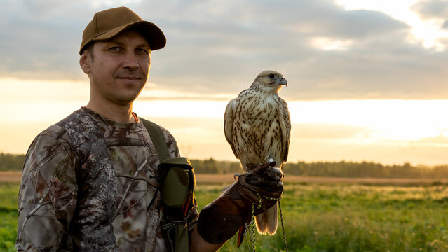 Hunter with a falcon on his hand