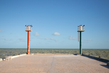 El Cuyo, Mexico; November 1, 2025: Footbridge leading to the sea in a Yucatan fishing village.