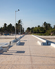 El Cuyo, Mexico; November 1, 2025: Footbridge leading to the sea in a Yucatan fishing village.