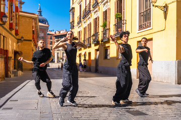 Group of contemporary dancers performing street choreography in madrid