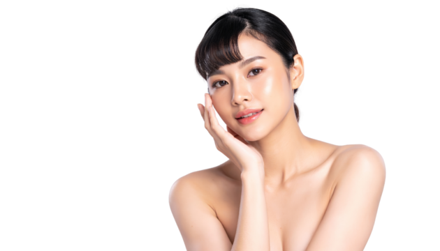 Graceful young woman posing softly with hand on face and serene expression