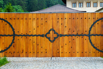wooden gate close-up with forged elements as an object