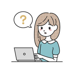 パソコンの前で考える女性