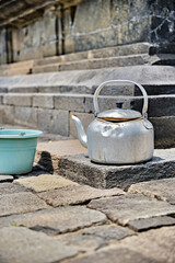 The forgotten teapot on the steps of the temple