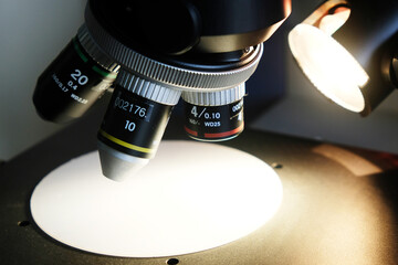 Close-up of a modern microscope lens in a laboratory