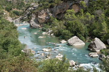 Gallego River near by Mallos de Riglos on sunny summer day. Huesca, Spain.