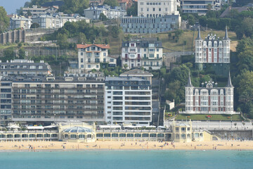 San Sebastian, Spain - 13th August, 2025: Attractions of the country. View of the town and La Concha Beach on sunny day.