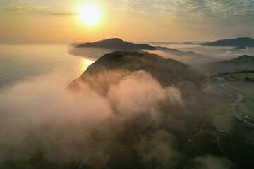 Sunrise aerial view of clouds above Zarautz town. Basque Country, Spain.