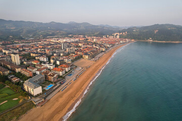 Drone view of Zarautz town and the beach on summer morning. Basque Country, Spain.