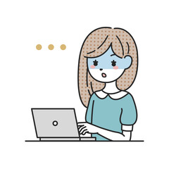 パソコンの前で青ざめる女性