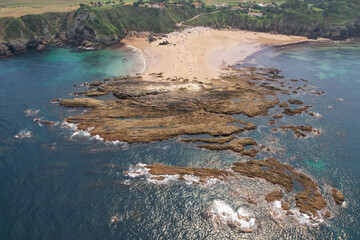 Bird's eye view of Amio Beach on sunny summer day. Pechon, Spain.