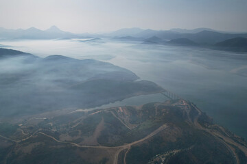 Aerial view of Riaño reservoir under the smoke from forest fires. Montaña de Riaño and Mampodre Regional Park, Castile and Leon, Spain.