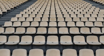 Fototapeta premium Empty beige stadium seats in symmetrical rows